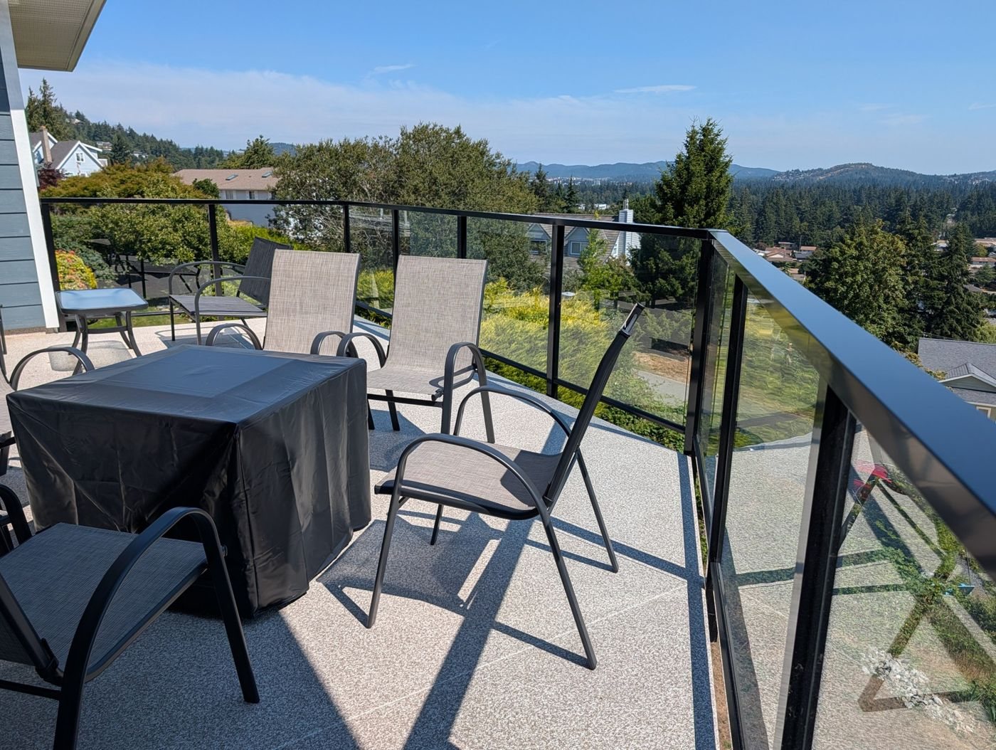 Finished deck with seating and railings overlooking the garden