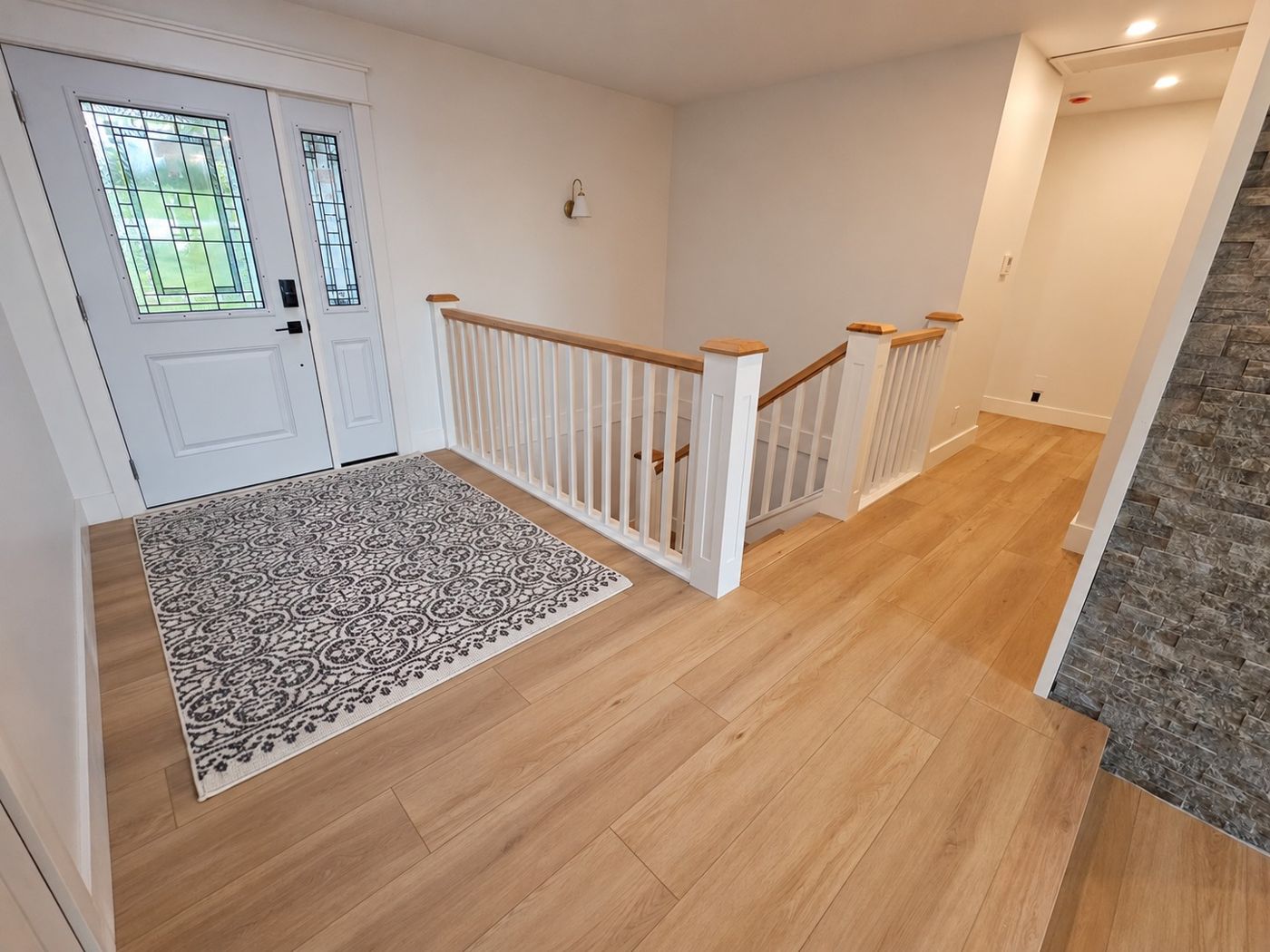 Interior finishing with flooring, trim and stonework
