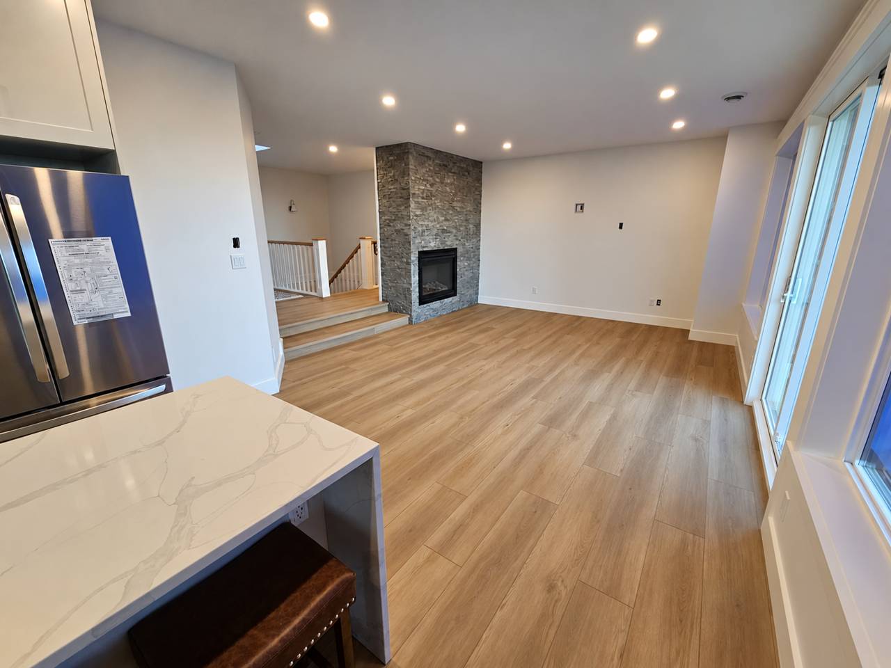 Stone fireplace surround in a renovated main floor