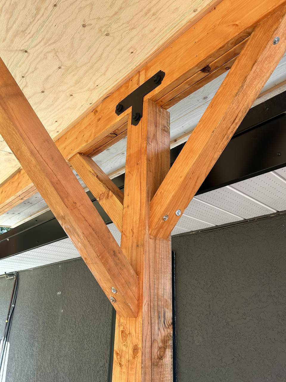 Custom outdoor living space - after - bracket detail