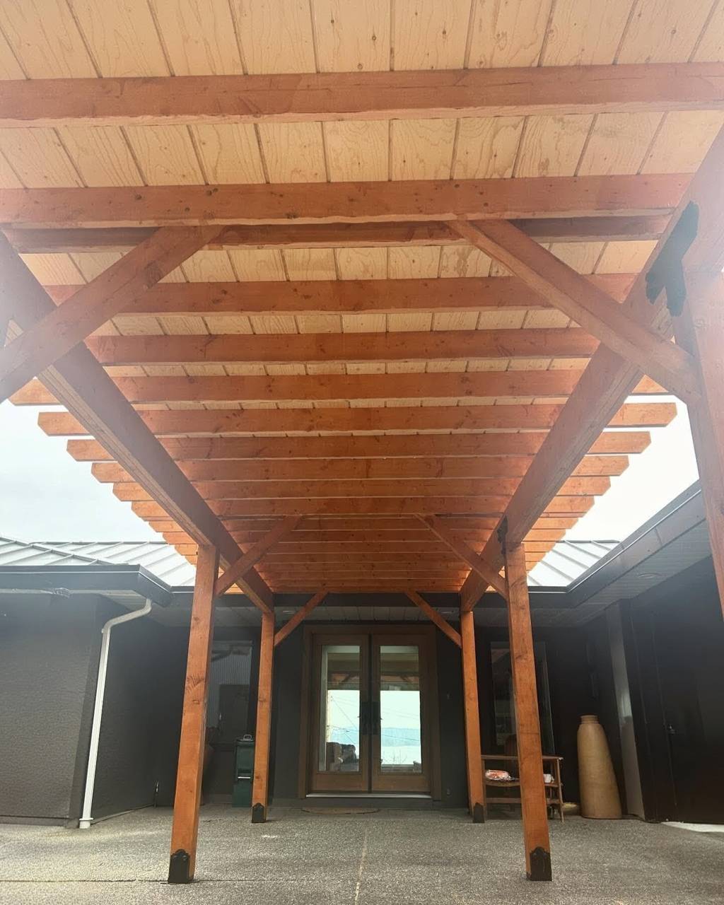 Custom outdoor living space - in progress - overhead structure