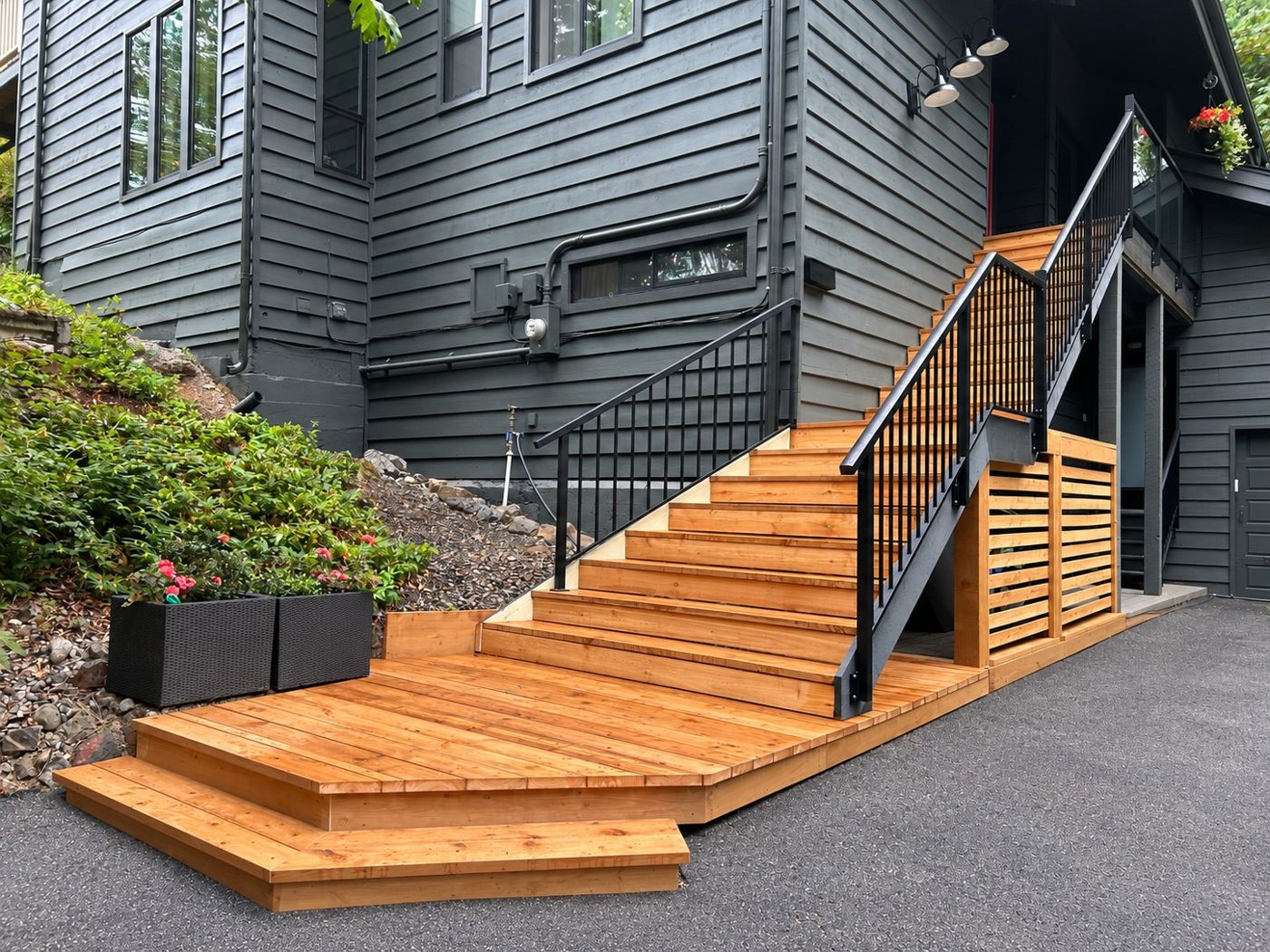 Custom exterior staircase and deck by Rise Renovations & Decks